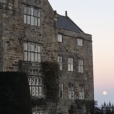 The full winter moon crowns Gwysaney Hall in silver - illuminating snow-kissed grounds and the s 1